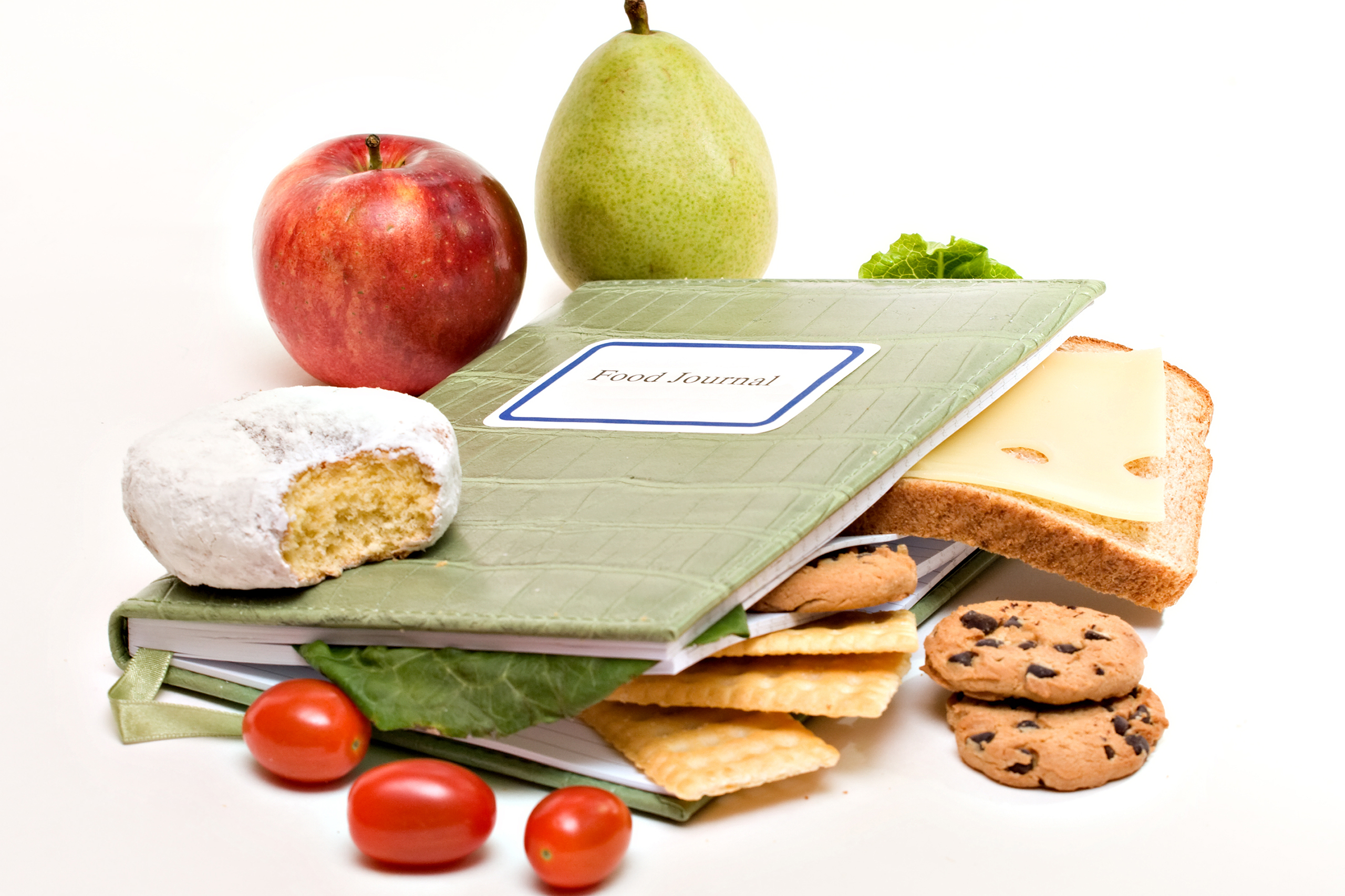 An image of a book surrounded by various fruit's including an apple, pear, tomatoes, bread, cheese, lettuce, cookies, crackers. Meal Plans at The Private PT Studio