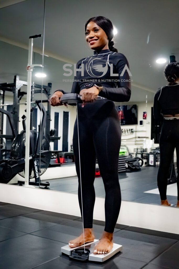 An image of a female client on a scale going through a preliminary assessment at The Private PT Studio. A Luxury Approach To Personal Training | Calcot, Reading, Berkshire