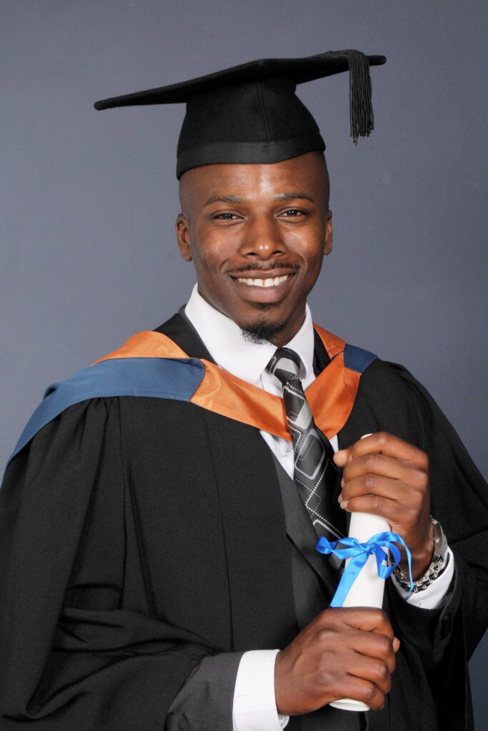 An image of Coach Shola graduation from a Bsc Exercise Nutrition and Health degree. Coach Shola, Personal Trainer, Nutrition Coach, owner of The Private PT Studio, A Luxury Approach To Personal Training | Calcot, Reading, Berkshire